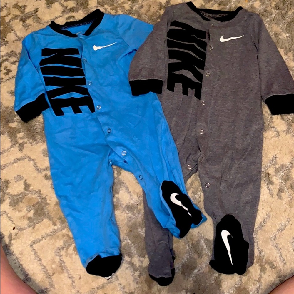 2 Nike footed onesies